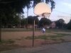 Cube hanging from basketball hoop